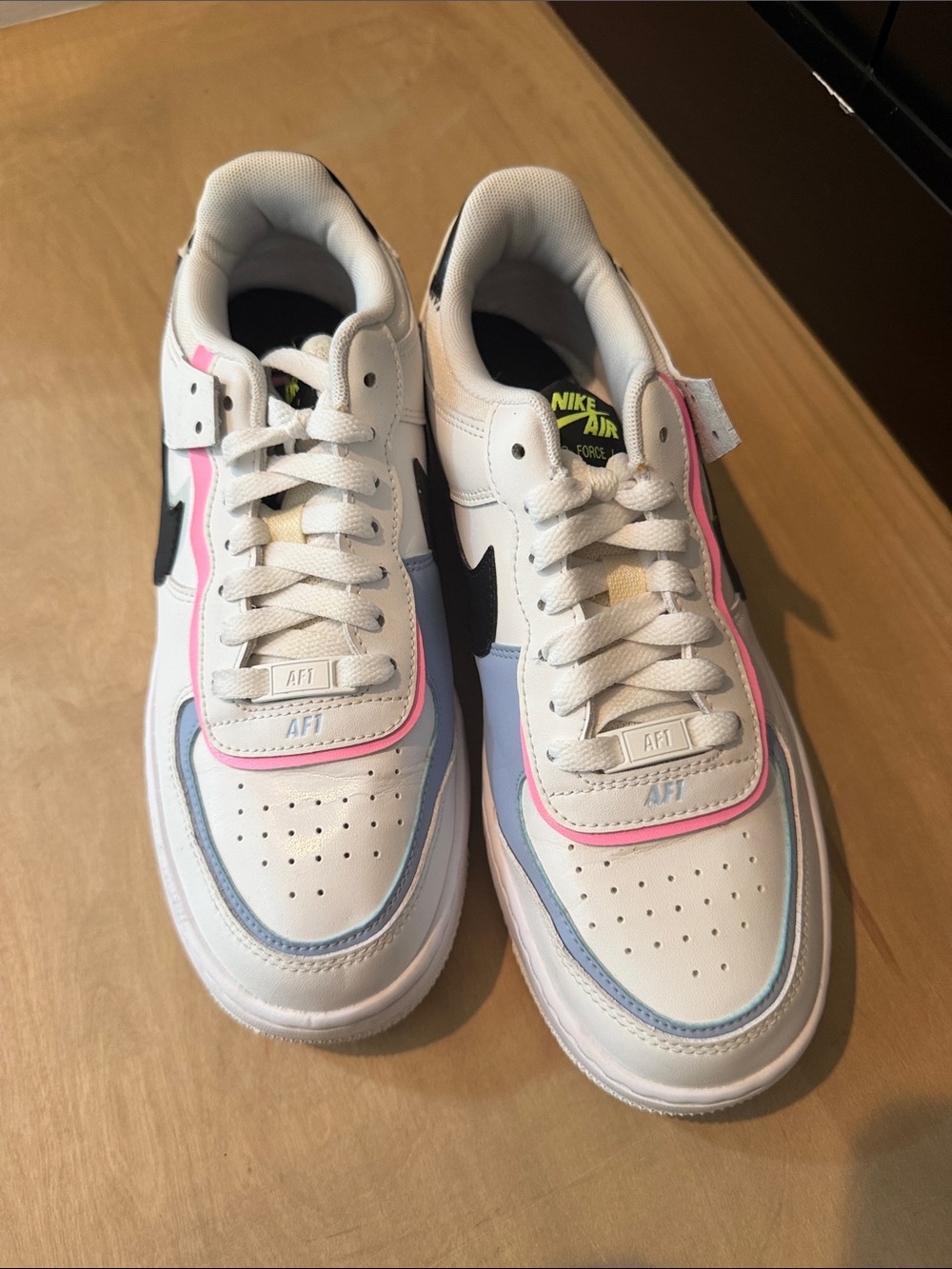 Nike Women’s Air Force 1 Sneakers in White, Black, Pink, Light Blue